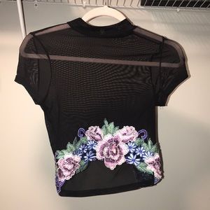 Sheer see-through black crop top.